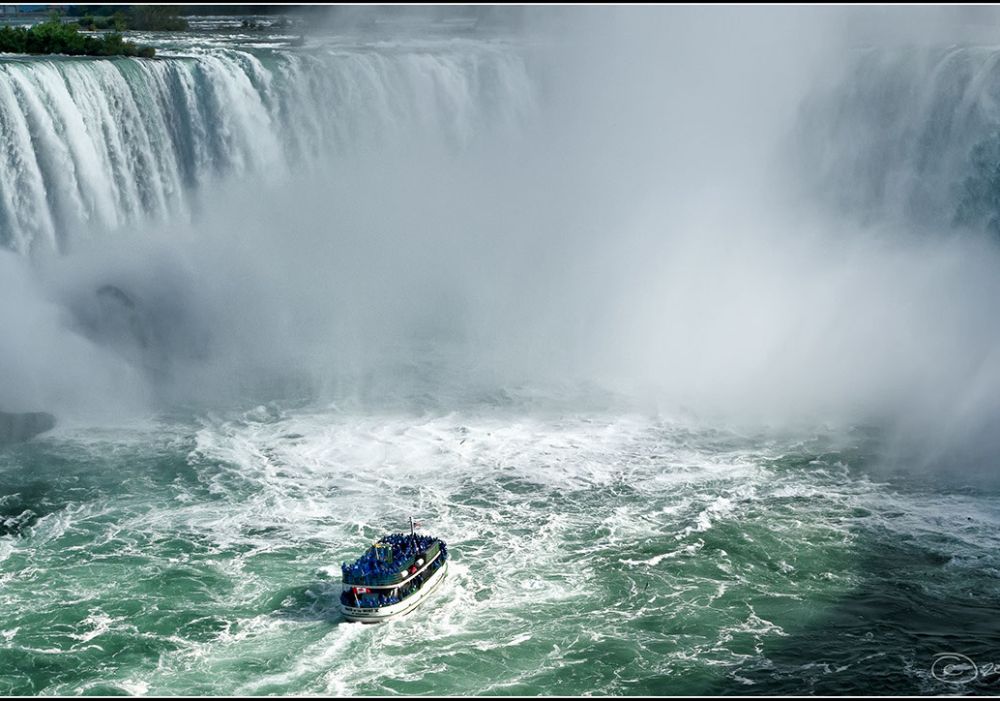 Boat approaching Niagara Falls mist – Canada Tour Package From India