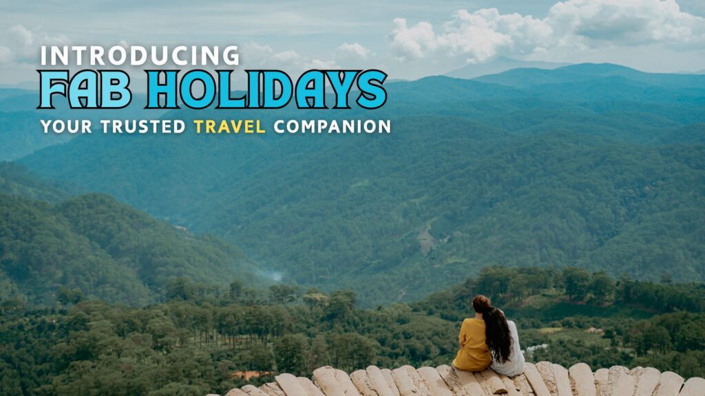 Two women enjoying a scenic mountain view, representing Fab Holidays as a reliable travel agency for serene and memorable adventures