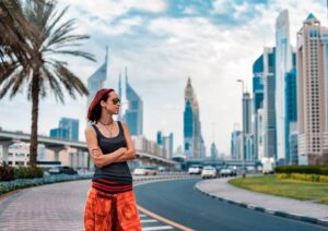 Woman traveler exploring modern skyscrapers in Dubai during a Dubai city tour package