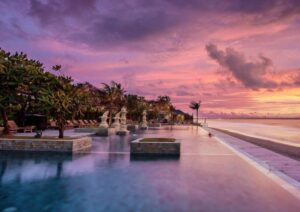 Luxury resort pool at sunset – Bali Tour Package from Delhi