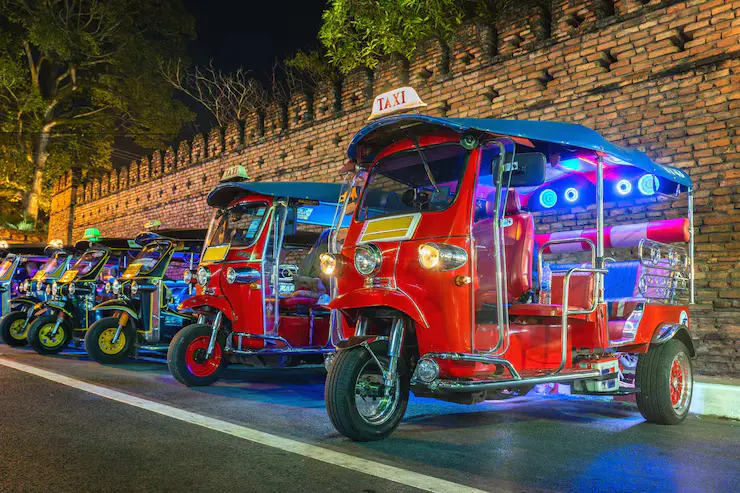 Colorful tuk-tuks in Bangkok at night – Bangkok Pattaya Phuket Krabi Tour Package by Fab Holidays, best travel agency in Delhi