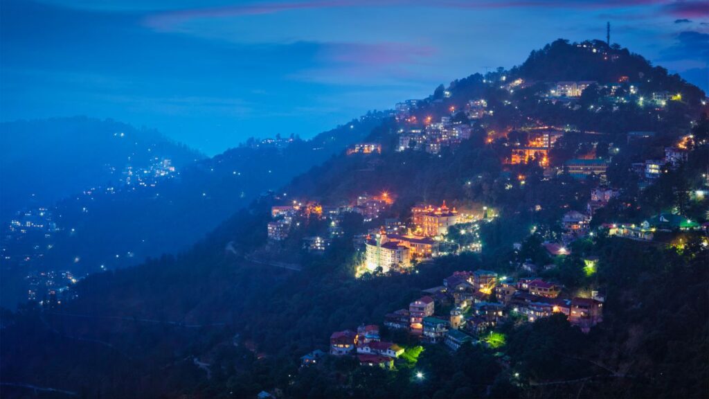 Night view of Shimla hill town illuminated with lights, one of the best honeymoon places in India in December, beautifully captured by Fab Holidays.