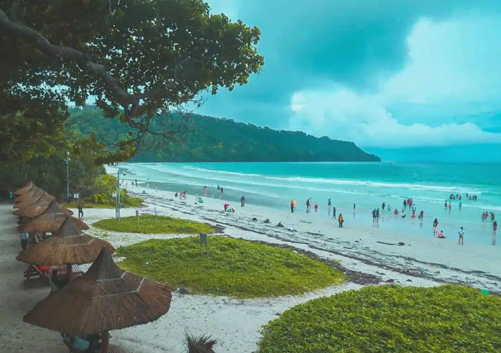 Family enjoying beach activities during Andaman family tour packages with 5-day island getaway and scenic ocean views