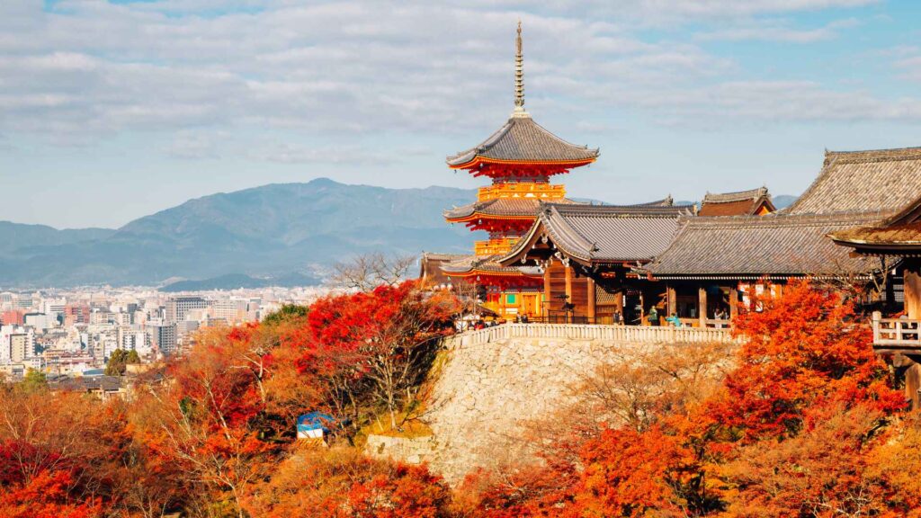 Kyoto's Kiyomizu-dera pagoda amid red autumn foliage, a top spot for Japan autumn foliage 2026 — Fab Holidays, Best Travel Agency in Delhi